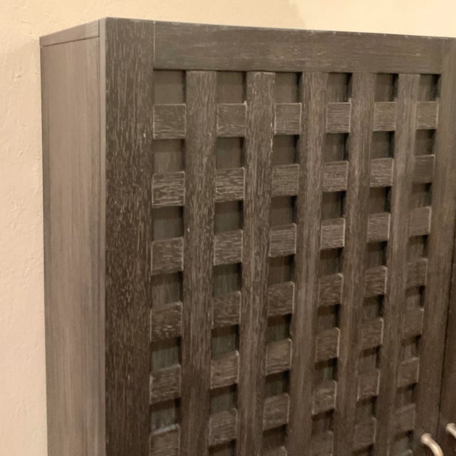 Stylish Klausner Modern Cerused black Oak Finished Bar Cabinet, two doors with elongated textured silver pulls revealing...