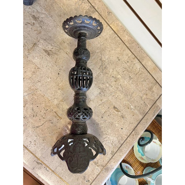 This vintage candle holder is a unique piece that adds a touch of design to your home decor. Made of heavy cast iron, it...