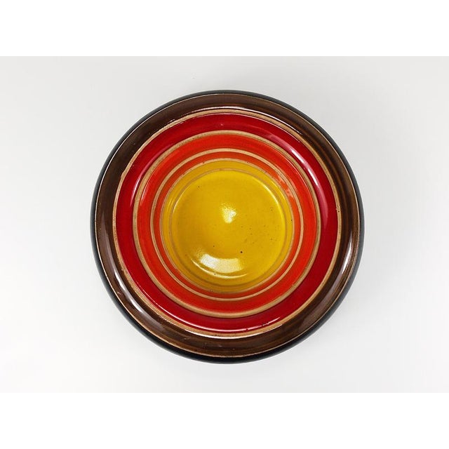 A beautiful round striped terracotta bowl, designed by Aldo Londi, handcrafted from ceramic by the Italian manufacturer...