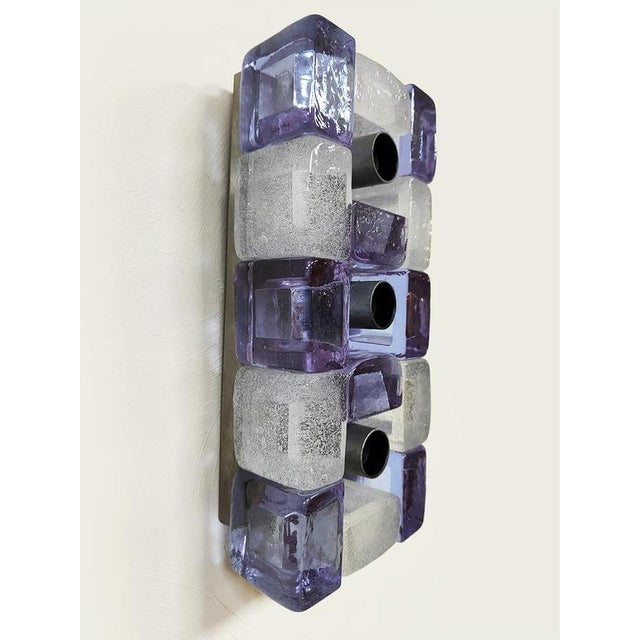 Bella Italia! This vintage wall lamp from the 1970s is crafted from a combination of white and purple Murano glass and...