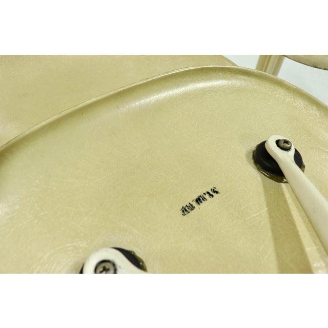 La Fonda dining chairs designed by Charles and Ray Eames for Vitra Herman Miller in the 1970s. The chairs have beige...