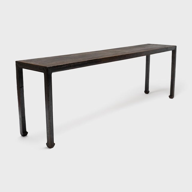With simplicity of form and balanced proportions, this grand console table from the early 19th century recalls the austere...