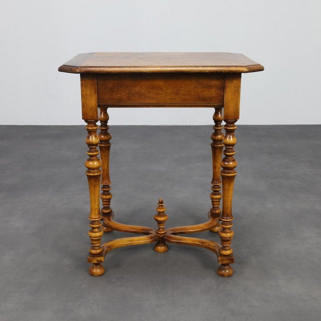 Elegant Neo-Baroque side table dating from the late 19th to early 20th century. Crafted in richly toned wood, the table...
