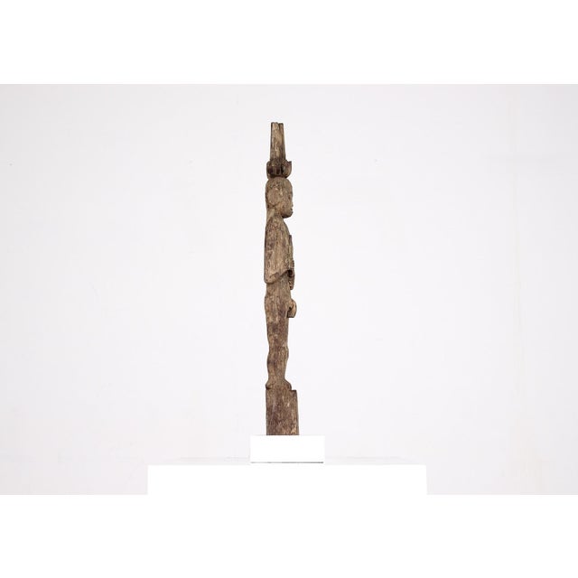 Ancestral hampatong figure carved in wood, dayak culture of borneo, 19th century or earlier. H with base 57.5 cm x d 5 cm...