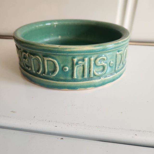 Rare Mcoy heavy stoneware Dog food bowl. Reads "mans best friend his dog"