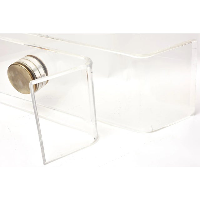 This wonderful angled and sculptural vintage luicte Karl Springer table base has brass caps. There is no glass provided...