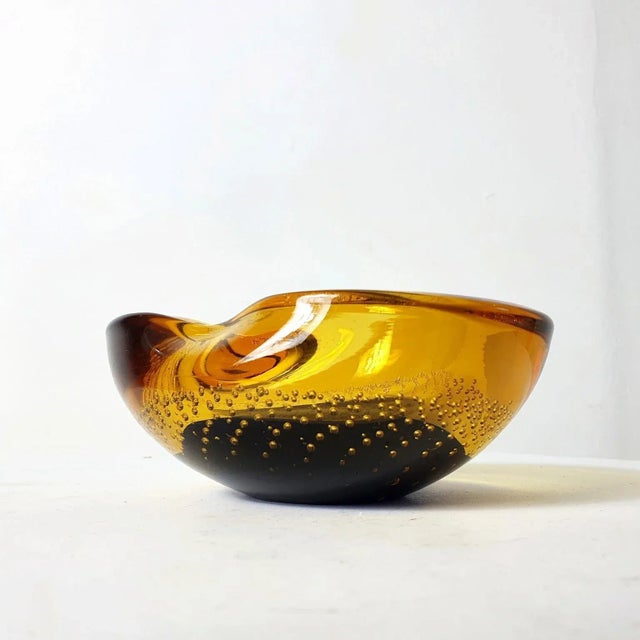 Organic shaped 1960's glass bowl in two colors from Murano with air-bubble pattern. Excellent for putting your keys and...
