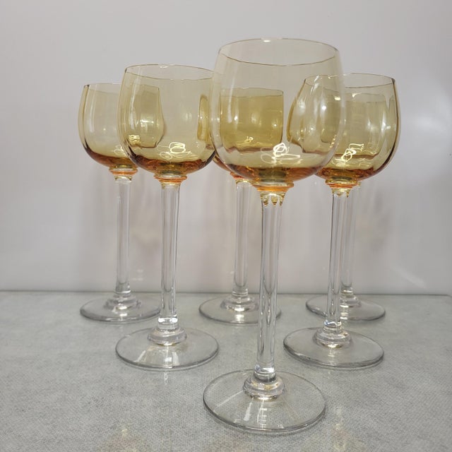 and 6 amber crystal wine glasses / Venetian size. Height 17.5 cm. Diameter at the rim 5.6 cm. They are all in good...