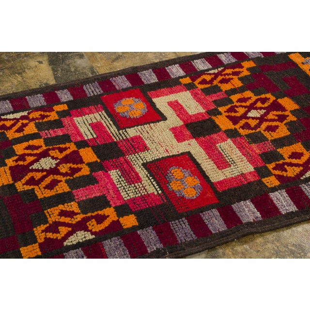 Handwoven in pure wool and originating circa 1950-1959, this 3x14 vintage Turkish kilim runner joins Rug & Kilim’s Vintage...
