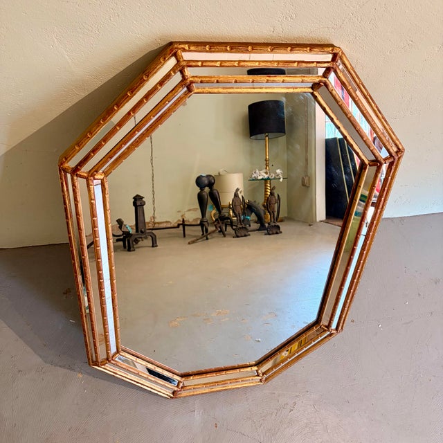 Striking vintage Hollywood Regency octagonal wall mirror, attributed to LaBarge, featuring a layered mirrored frame...