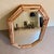 Striking vintage Hollywood Regency octagonal wall mirror, attributed to LaBarge, featuring a layered mirrored frame...