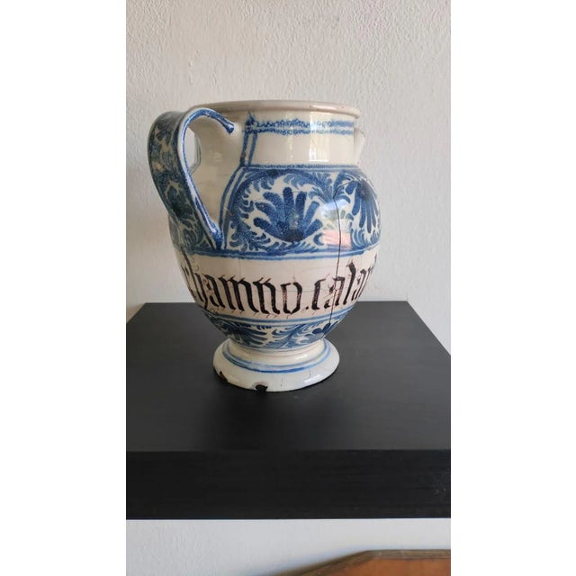 Pharmacy jar, Bassano, early 20th century, in majolica, monochrome blue decoration, with leafy shoots and polypetal...