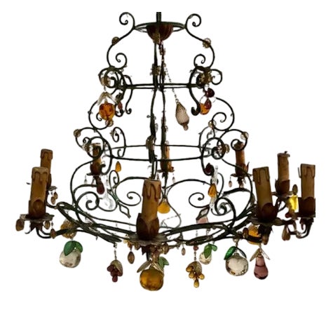Vintage Wrought Iron Chandelier Decorated with Pendants of Various Shapes and Sizes and a Floral Theme For Sale
