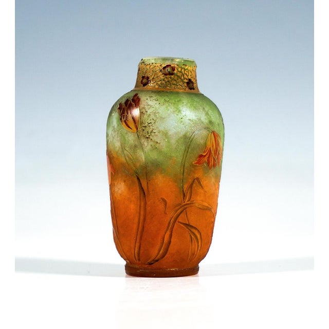 Small baluster vase on a recessed footring, a bulbous, slightly flaring body tapering to a short, slightly inward-sloping...