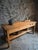 An antique work table dating from the early 20th century, originating from France. Crafted from solid cherry wood with a...