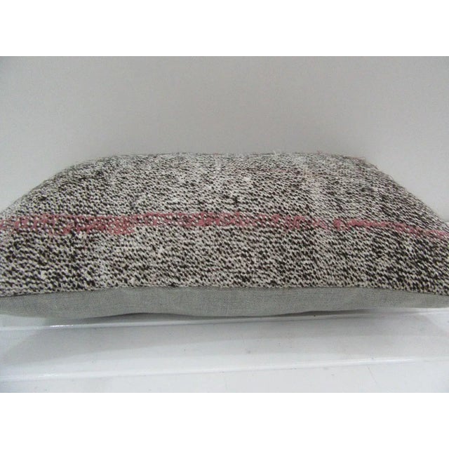 This is a pillow cover made from a vintage kilim rug. The piece was properly washed and ready to use. Pillow inserts not...