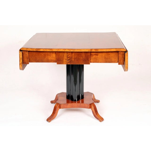Biedermeier birch drop leaf writing / sofa table, circa 1835. With a rectangular birch top with two drop leaves, a frieze...