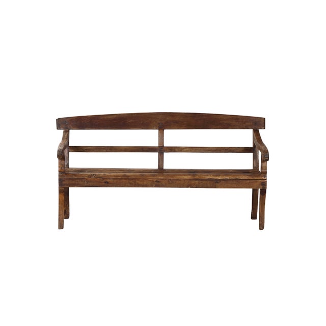 Antique Indian Teakwood Bench, a European ladderback form in natural teak, with rolled arms and slightly splayed feet....