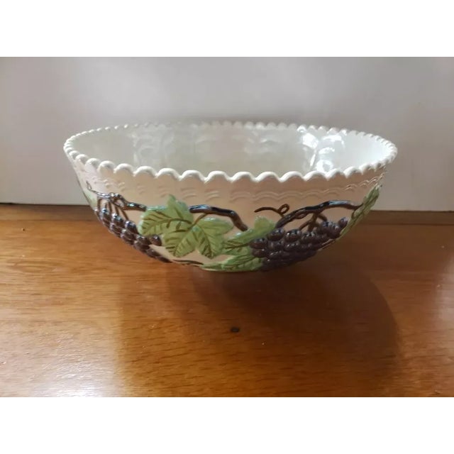This is a Circa 1970 MCM Iridescent Ceramic Grapevine Pattern Centerpiece Bowl. It measures 5" high and 11 1/4“ in...