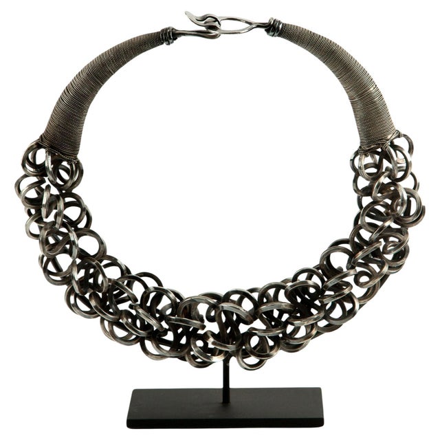 A striking traditional silver choker from the Miao ethnic minority, crafted with chains of densely interlinked, hand-...