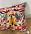 Elegant decorative pillow upholstered in a richly patterned Uzbek textile, featuring charming floral flowerhead motifs and...