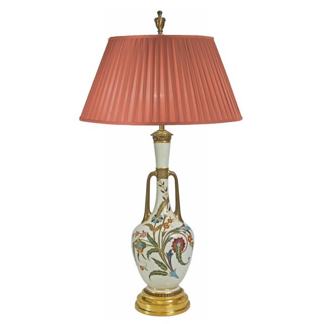 Exquisite antique Royal Worcester vase, designed in the Persian style, fitted as a table lamp. The vase has a bottle shape...