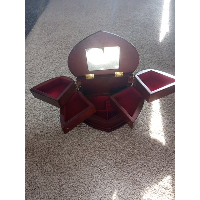 EXQUISITE Bombay Mahogany Wood Heart Shaped Swivel Jewelry Box. Width 8" Length 6" Height 5" The EXQUISITE Bombay Mahogany...