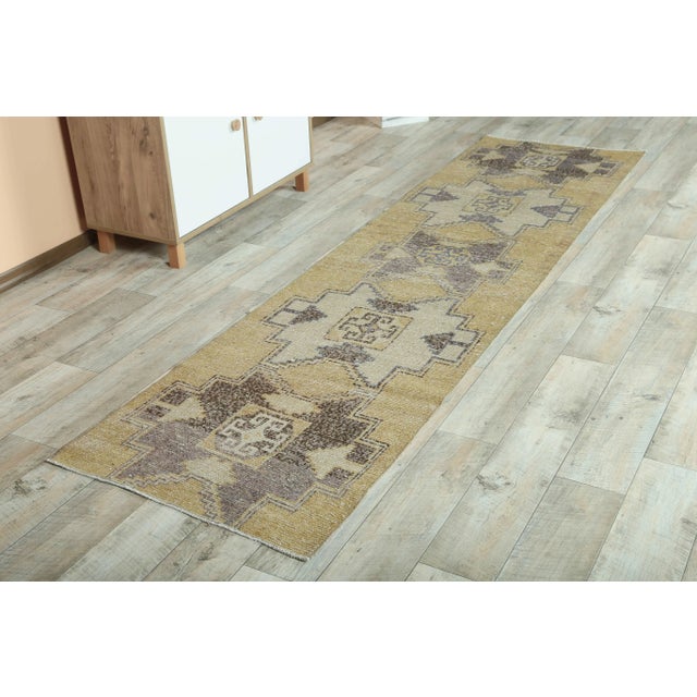 Vintage Turkish Hand-Knotted Runner Rug is a semi-Vintage runner rug. '70s Eastern region of Turkey's unique rug is...