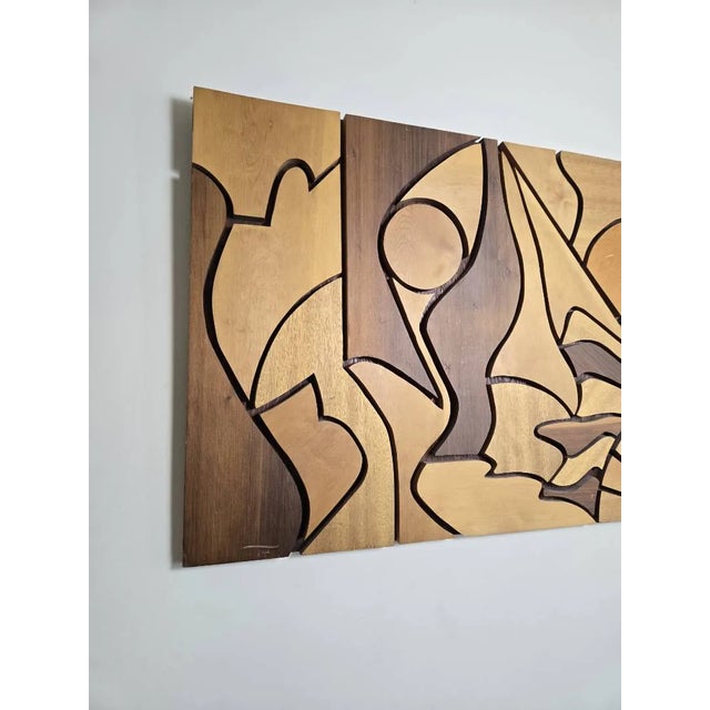 Striking modernist abstract carved wood wall art sculpture, circa 1960s. This substantial piece features deeply carved...