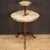 French étagère furniture from the early 20th century. Side table carved in mahogany wood richly adorned with gilded and...