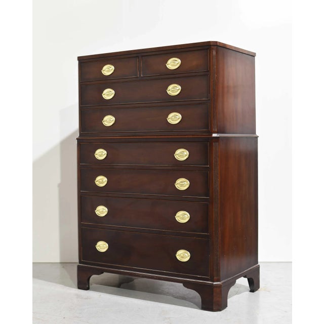 We have a handsome 1960s Georgian Mahogany Highboy Dresser by Kindel Furniture of Grand Rapids, MI. This solid wood chest...