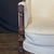 French Louis XVI armchair or bergere à la Reine (Queen’s chair) having an exquisitely carved walnut frame, fluted arms and...