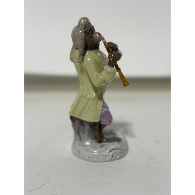 Meissen Style Porcelain Monkey Band Flute Player. Measurements: 4.875" h x 2.25" w.