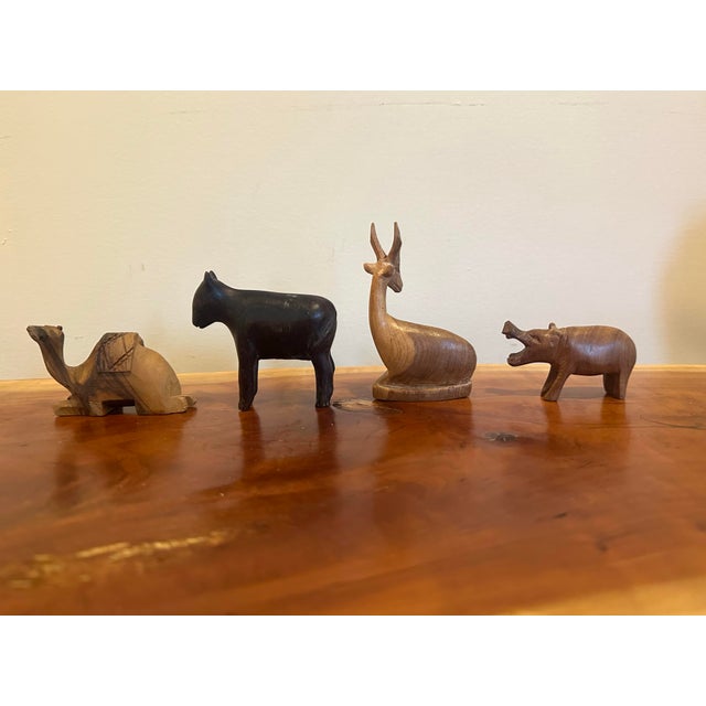 Bring warmth and character to a shelf, tabletop, or curated vignette with this delightful collection of nine hand-carved...