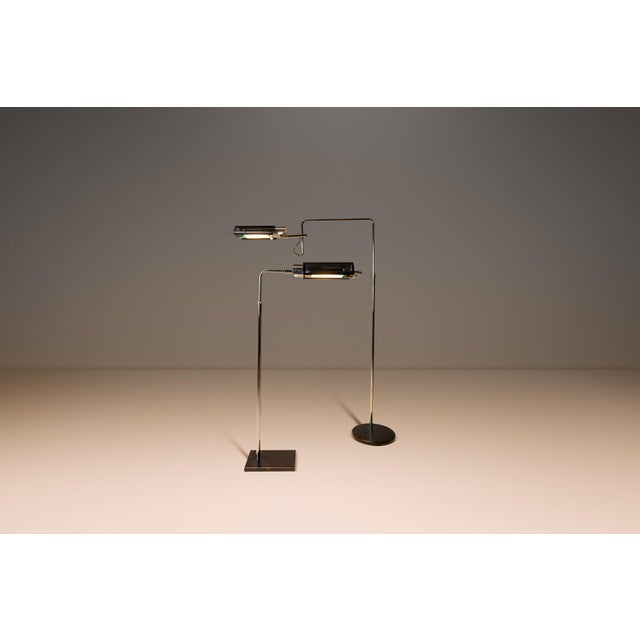 Introducing a rare, early pair of "Eyeshade" floor lamps designed by the influential George Nelson for Koch & Lowy....