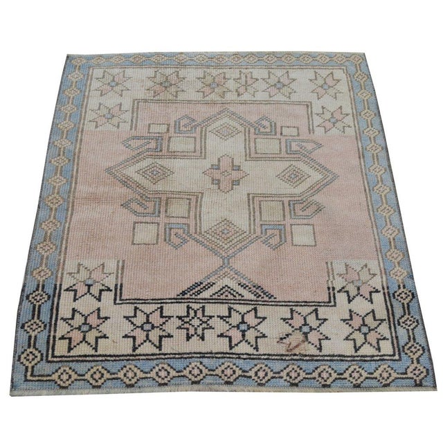 Hand-knotted with care using traditional rug-making techniques, this wool rug blends timeless craftsmanship with a modern...