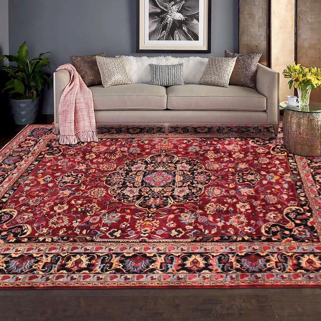 Bring timeless elegance and warmth to your space with this beautiful hand-knotted wool rug measuring approximately 10.2 x...