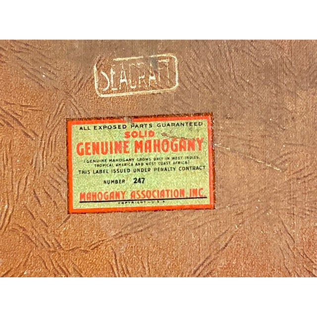 A richly patinated mid-century nautical serving tray by SeaCraft, constructed with a solid genuine-mahogany surround,...