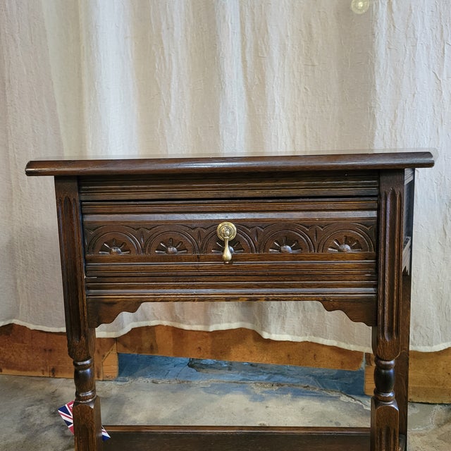 This is a nice size English Oak Carved Drawer Front Angle Sided Table on turned legs with a potboard base. It would work...