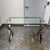 Design Plus Gallery presents the Ava Metal & Glass Desk from Pottery Barn. The desk showcases a rectangular clear tempered...