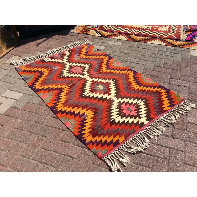 This beautiful, vintage, handwoven kilim is approximately 60 years old. It is handmade of very fine quality, hand-spun...