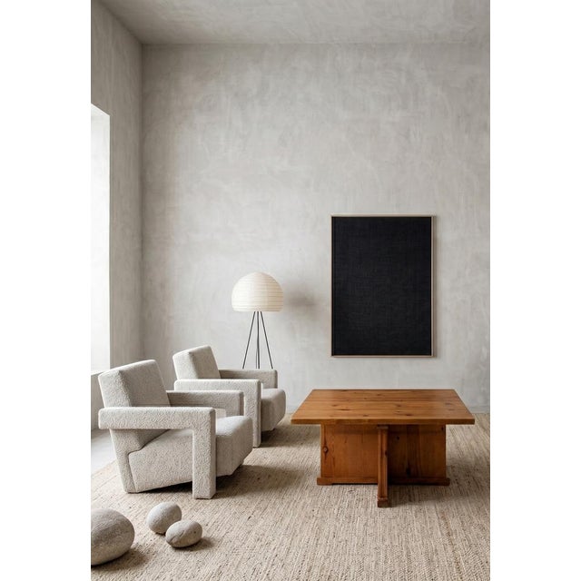 A sober coffee table from the 1960s, crafted from pine wood, representative of the rationalist style where structure and...