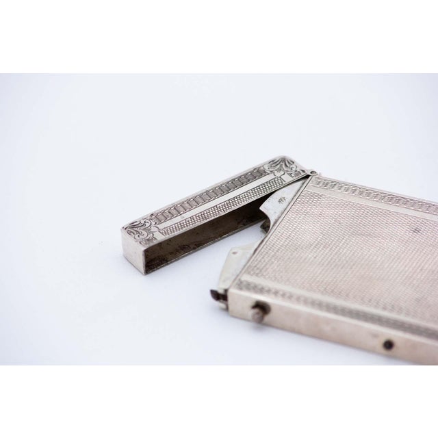 Rectangular Guilloche Silver Cardboard Box, in Very Good conditions. Designed from 2000 This piece has an attribution...