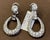 A fabulous pair of earrings with an enormous amount of look and sparkle! These exquisite pair of earrings features round 1...