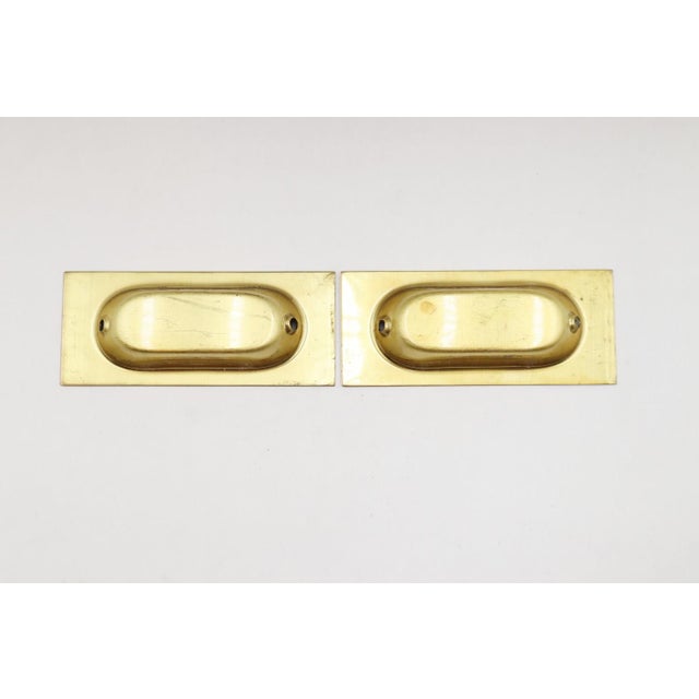 Classic style polished brass rectangular recessed window sash lifts. Mounting screws are included. Good condition with...