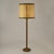 Elegant 1960's floor lamp in mid brown leather with large parchment leather shade creating a warm light. The hand made...