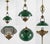 A classic vintage banker’s style hanging pendant lamp featuring a rich green enamel dome shade, warm antique brass finish,...