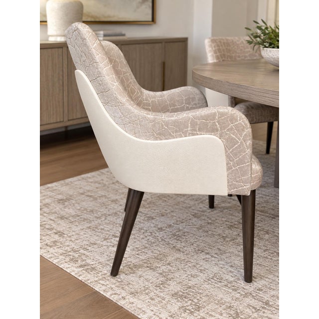Stunning set of 4 Adriana Hoyos Galapagos 100 armchairs, featuring a sophisticated custom upholstery combination and dark...