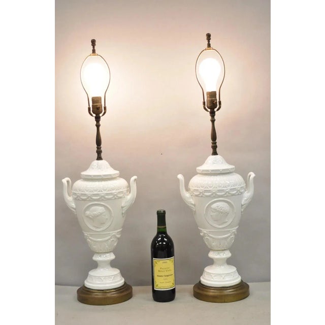Antique Italian Neoclassical Style Greco Roman White Porcelain Twin Handle Urn Form Table Lamps with Busts of Julius...