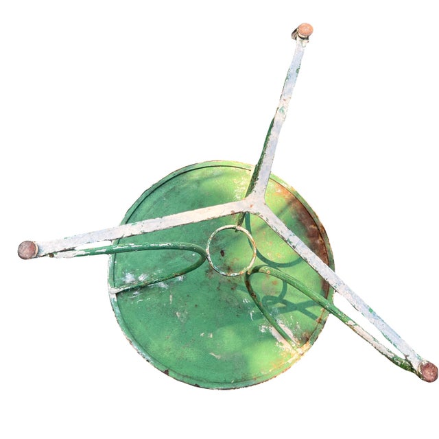 A beautifully distressed and well preserved iron cafe table in original green paint. Originating from France near or at...